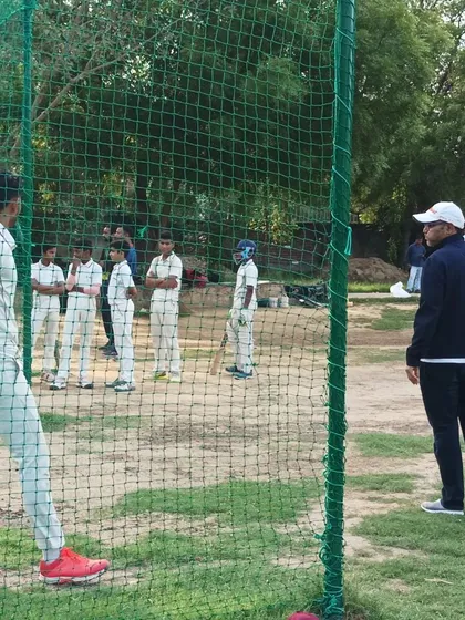 Observing and learning from the best is fundamental to our program. Trainees watch closely as our mentor oversees a net session, providing real-time guidance.