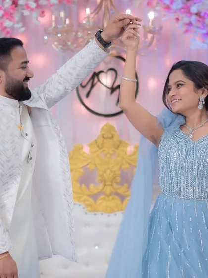 A fairytale moment from an engagement party. The bride is wearing a stunning blue gown, and I created a soft glam makeup look with romantic curls to match.