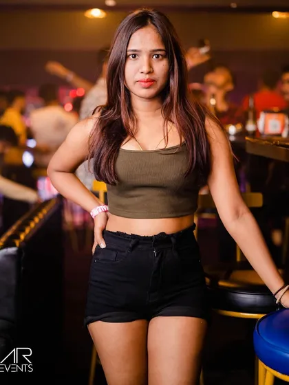A guest posing at the bar.