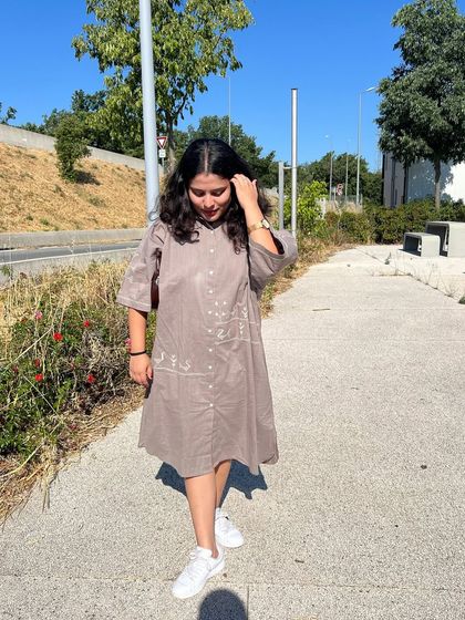 Another view of our customer in the Bagh Anti-fit Dress. The dress is designed to be effortless and easy to wear, perfect for any adventure.