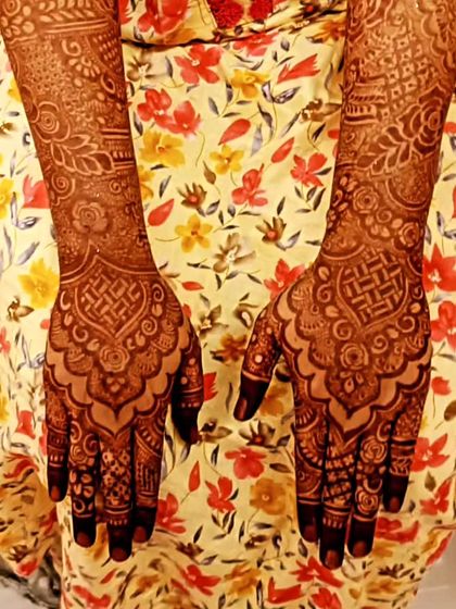 The beautiful, dark stain of two different bridal designs, showcasing the quality of my organic henna.