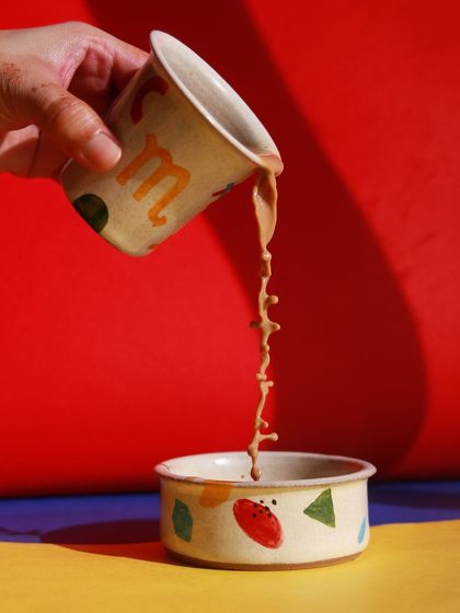 A cup and bowl from the 'Playful Mornings' collection, showcasing the fun, abstract designs and vibrant colors that define this cheerful breakfast set.