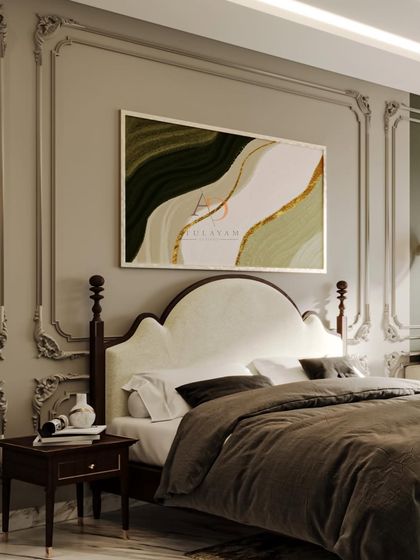 A closer look at the abstract art and the elegant curved headboard, set against detailed neo-classical wall mouldings.