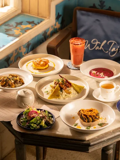 A beautiful spread of dishes at the Taj Mahal Tea House, showing a full meal experience.