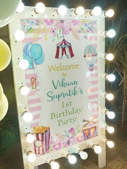 The welcome sign for the carnival party was framed with classic marquee lights, giving it an authentic and festive circus feel.