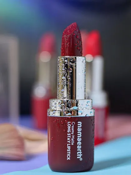 For cosmetic brands, I focus on creating a luxurious feel. This close-up of a Mamaearth matte lipstick, covered in fine water droplets, emphasizes its rich color and hydrating quality against a soft, dreamy background.