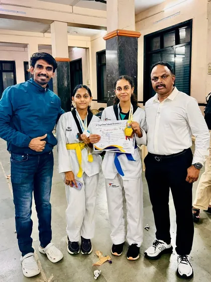 My students, Laisha and Vedika, with their medals and certificates after a successful competition.