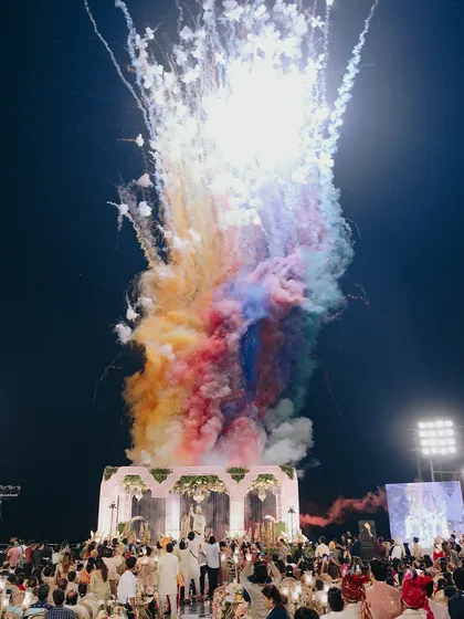 I believe in creating moments that feel larger than life. This spectacular display of colorful fireworks over the wedding mandap was the perfect crescendo to a beautiful ceremony, lighting up the night and the hearts of everyone present.