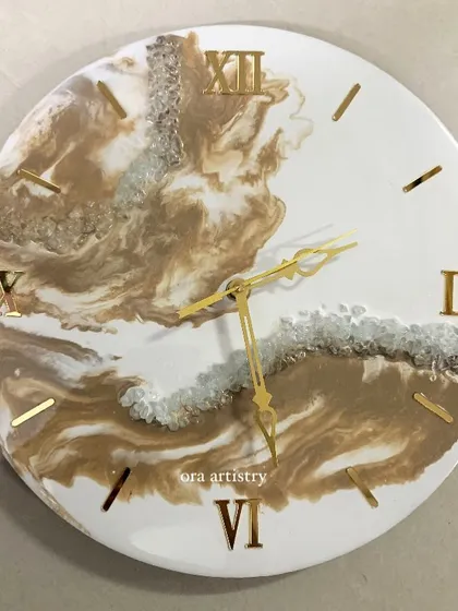 A classic brown and white marble resin clock, perfect for a neutral and elegant home decor style.