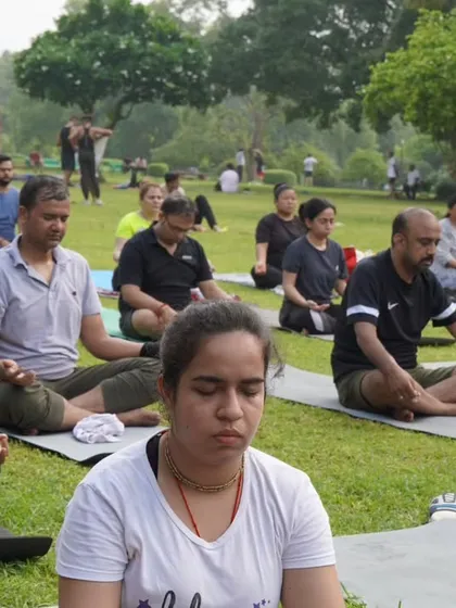 A moment of quiet meditation in the park. Practicing outdoors adds a special dimension to our mindfulness sessions.