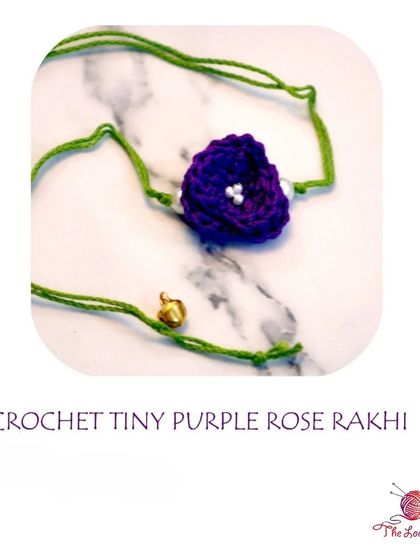 A single, elegant Tiny Purple Rose Rakhi. Sometimes the simplest designs are the most beautiful.