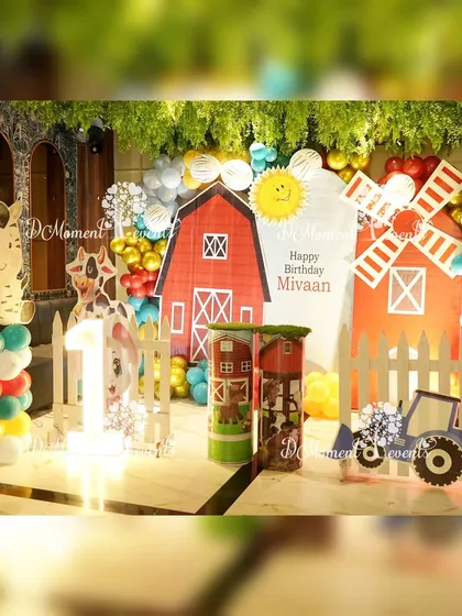 A wider view of the farmland party setup, showing how the theme is integrated into the venue with greenery and rustic props.