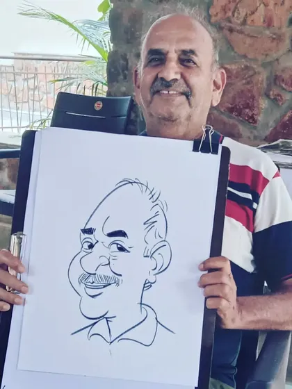 A gentleman posing with his freshly drawn caricature at a corporate event. My on-the-spot drawings are a great way to engage attendees.