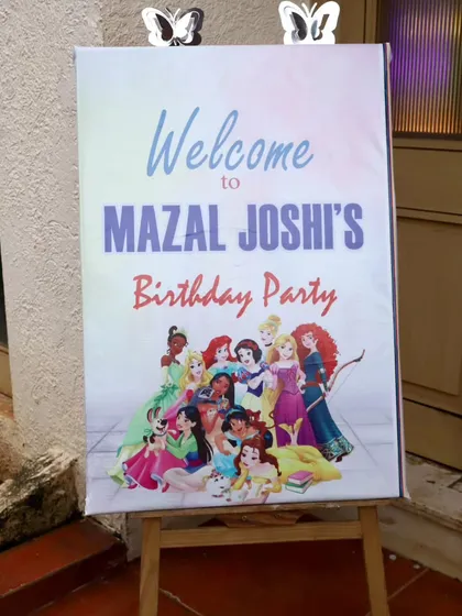 The custom welcome sign for Mazal Joshi's 4th birthday party, featuring a host of Disney princesses.