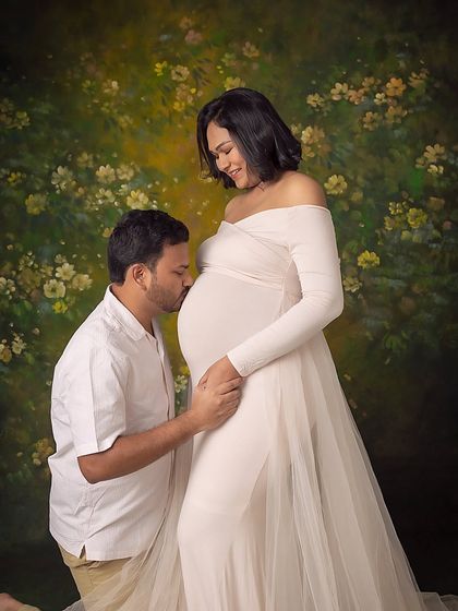 A kiss for the baby. This classic pose is always full of love and tenderness.