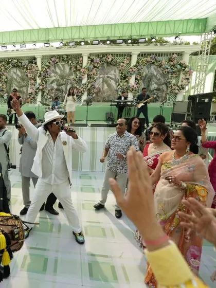 I love getting off the stage and into the crowd. Here I am dancing with guests at a beautiful daytime wedding carnival in Bangalore. It’s all about creating an interactive live music experience and making everyone feel like part of the show.