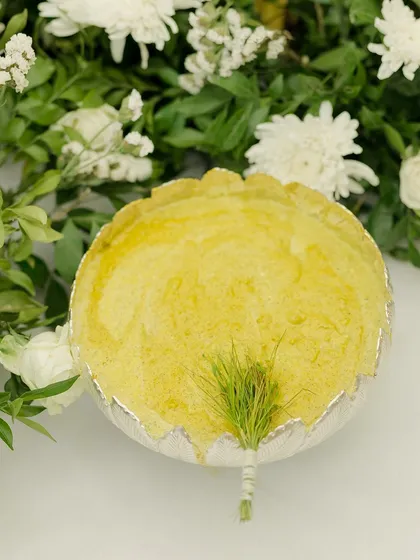 Love leaves a mark, but in Indian weddings, it starts with a glow. A bowl of fresh haldi paste, ready for a ceremony filled with messy, magical, and meaningful moments.