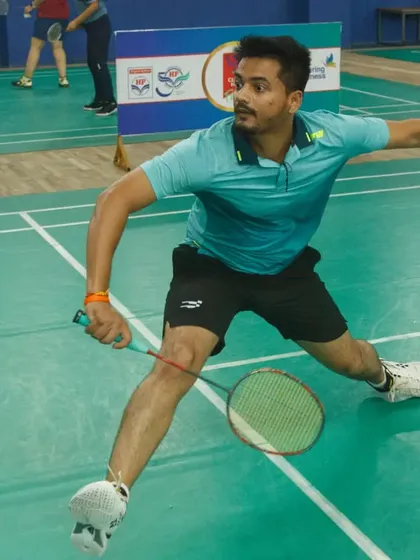 An employee participates in the HPCL All India Inter-Unit Sports & Games tournament. We specialize in organizing corporate badminton events that foster teamwork, wellness, and healthy competition within organizations.