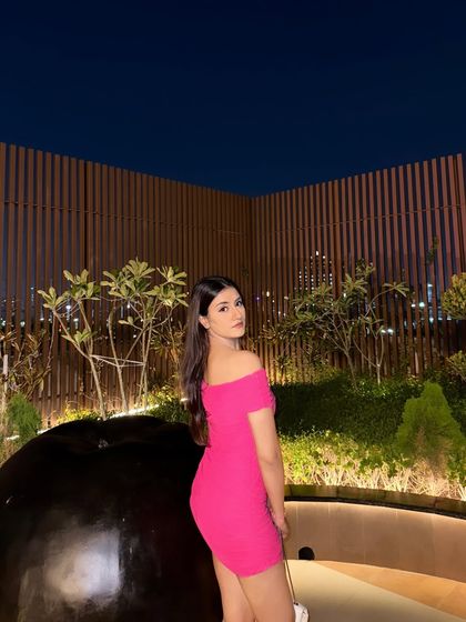 A side profile, showing the fit of the dress.