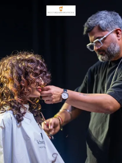 A close-up look at the precision required for cutting and shaping curly hair. Every detail matters when you're crafting a look that enhances natural texture and movement.