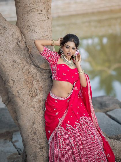 A beautiful outdoor shot of the pink lehenga look, showing how makeup looks in natural light.