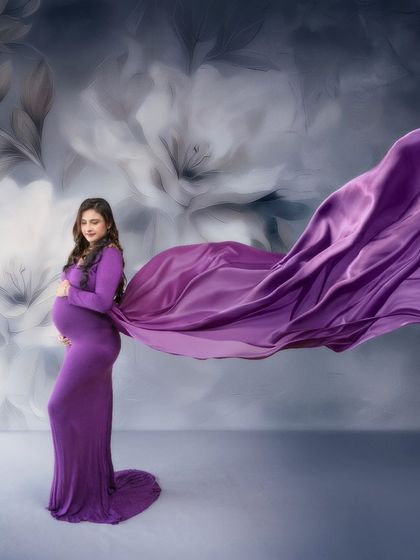 The soft caress of fabric and the gentle glow of motherhood. This image tells a story of life about to bloom, with a stunning cascade of purple.