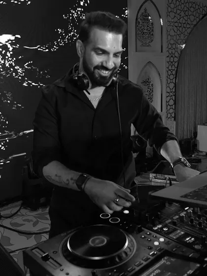 In my zone, chasing that perfect drop. These black and white shots capture the focus and joy I find in creating the perfect party atmosphere.