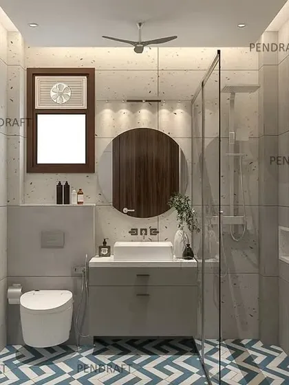 To make this small toilet feel more spacious and vibrant, we used a bold blue and white chevron pattern for the floor tiles, paired with simple, light-colored wall tiles.