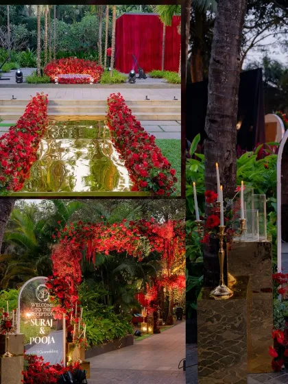 The reception entrance featured a stunning arch of red flowers and a personalized welcome sign. The pathway was lit with candles, creating a warm and inviting golden glow.