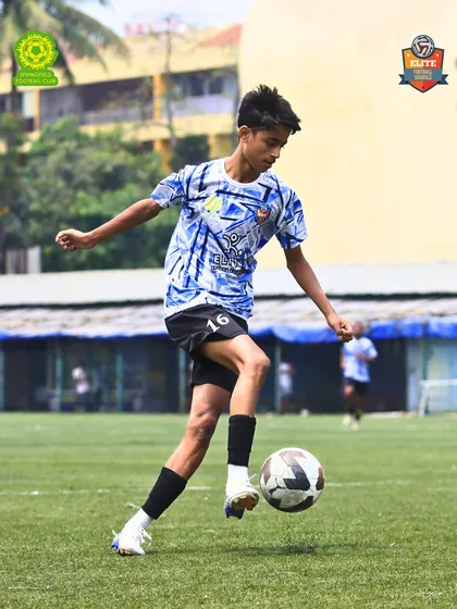 A young player displaying excellent ball control and technique, a hallmark of our academy's training philosophy.