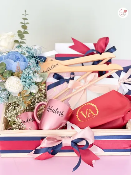 A complete hamper for the couple, including personalized hangers, monogrammed mugs, and other custom items in a red and blue theme.