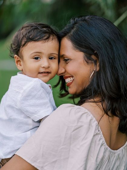 A mother and son sharing a close moment. The genuine connection and her bright smile make this a standout photo.