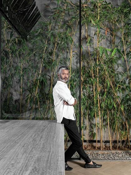 Ar. Sumit Dhawan at our studio, which is designed with biophilic elements like a bamboo-filled courtyard. This connection to nature is central to our design philosophy and our work environment.