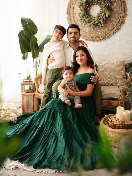 So much love in one frame. This family portrait in my cozy, boho-themed studio setup captures a relaxed and happy moment between parents and their two boys.