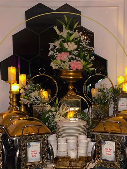 A feast for the eyes is the prelude to a feast for the palate. Our buffet setups feature luxurious gold chafing dishes, elegant floral arrangements, and ambient candle lighting to create a truly opulent dining scene.