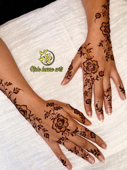 A simple and elegant rose vine design. This is a great choice for bridesmaids or guests at a wedding who want a beautiful but not too heavy mehandi pattern.
