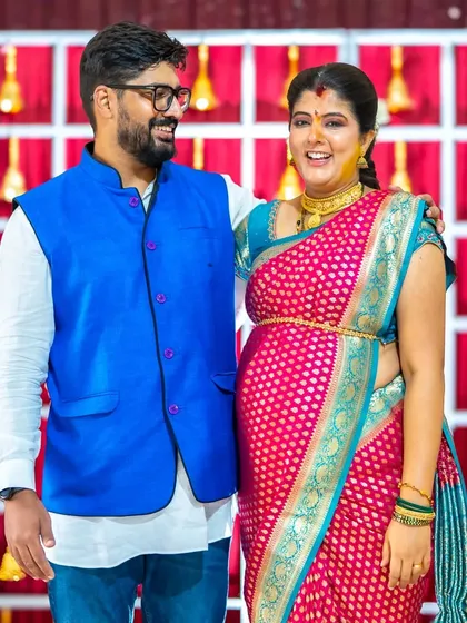 The look of pure love and excitement between expecting parents is something truly special. This candid moment from their baby shower is filled with so much warmth and anticipation.