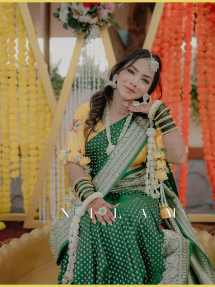 A stunning portrait of the bride on her Haldi day. Her confident pose and beautiful attire make for a memorable shot.