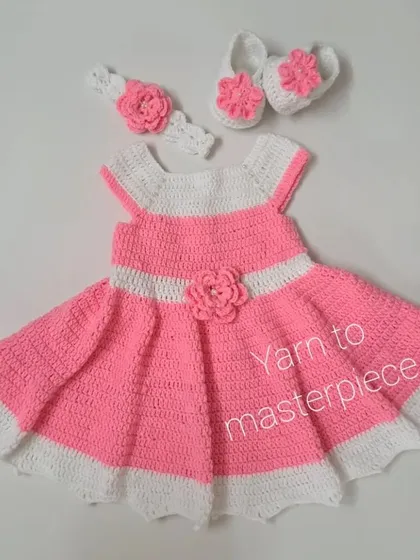 A complete view of the pink and white floral frock set, showing how the matching headband and booties create a beautifully coordinated outfit for any celebration.