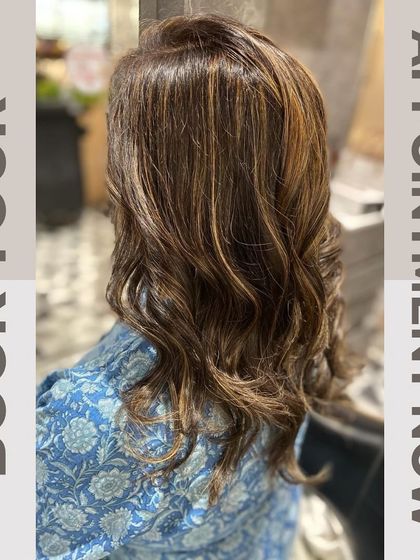 A graphic encouraging clients to book their appointment, featuring a beautiful example of our highlight and styling work.