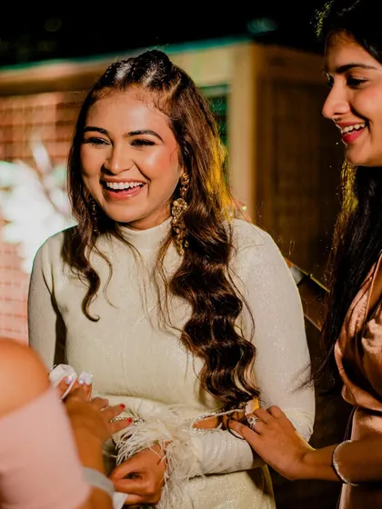 For a cocktail party, I created this edgy look with tight braids on top and soft waves. It's modern, chic, and perfect for a night of dancing.