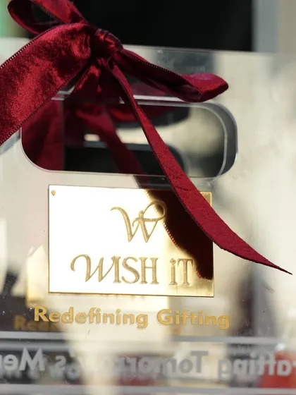 A close-up of our clear acrylic gift bag with custom gold branding. This was a popular item at our Bengaluru pop-up, perfect for creating a modern, elegant gift.