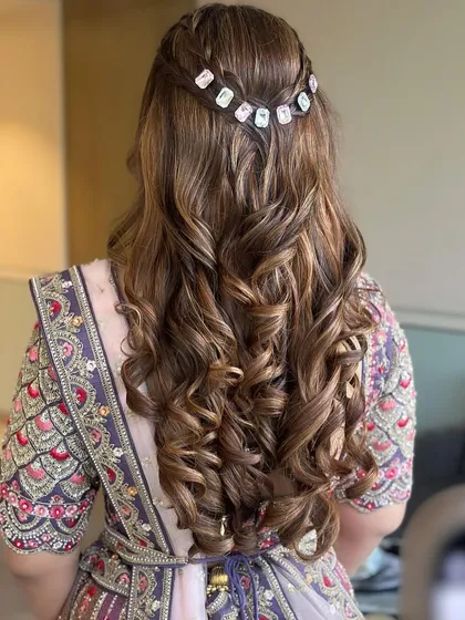A closer view of the beautiful braided detail and the bouncy curls, perfect for a Mehendi or Sangeet.