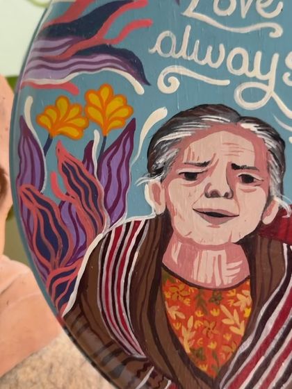 A close-up of a memorial portrait painted on a wall plate. Capturing the likeness and spirit of a loved one is an honor I take very seriously.