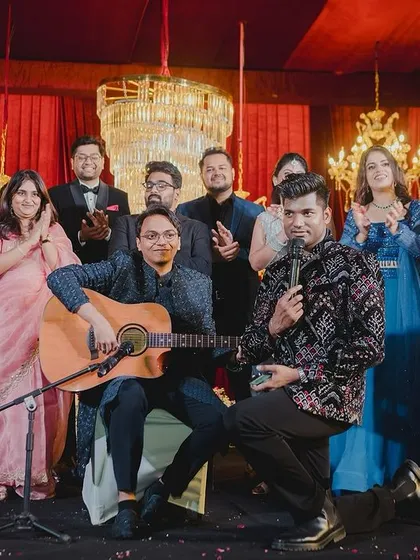 A snapshot from a beautiful Sangeet night. I'm right there on stage, mic in hand, orchestrating a fun segment with the family. My goal is to be more than an anchor; I become part of the celebration.