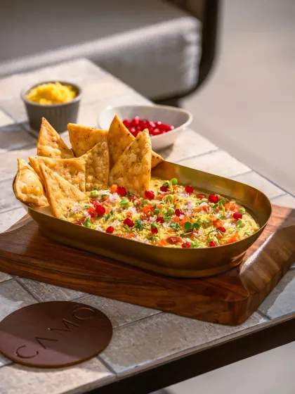 A modern take on chaat from Camo, Noida, served in an elegant brass boat-shaped bowl.