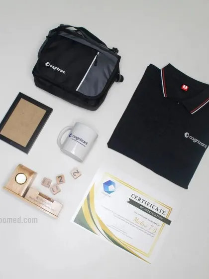 For Cognizant, we assembled this comprehensive welcome kit featuring a branded polo shirt, a sling bag, a mug, a wooden desk organizer with a calendar, a certificate, and a photo frame.