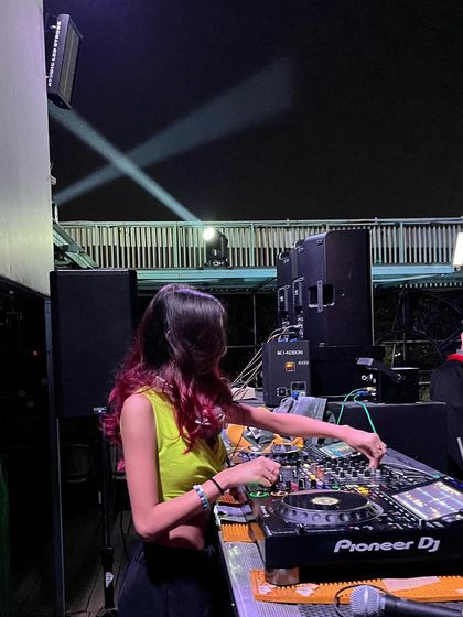 Taking a moment to mix at Agent Jack's in Bhopal. The stage setup with spotlights created a great performance environment.