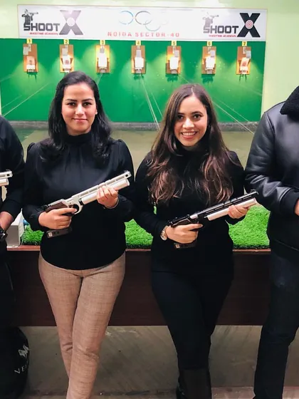 Posing for a photo after a fun session. Our range is the perfect place for a unique group outing or team-building activity.