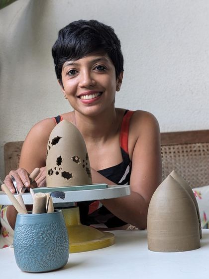 Another portrait from the "pottery debutantes" series, featuring a student with her beautiful pierced luminaries.